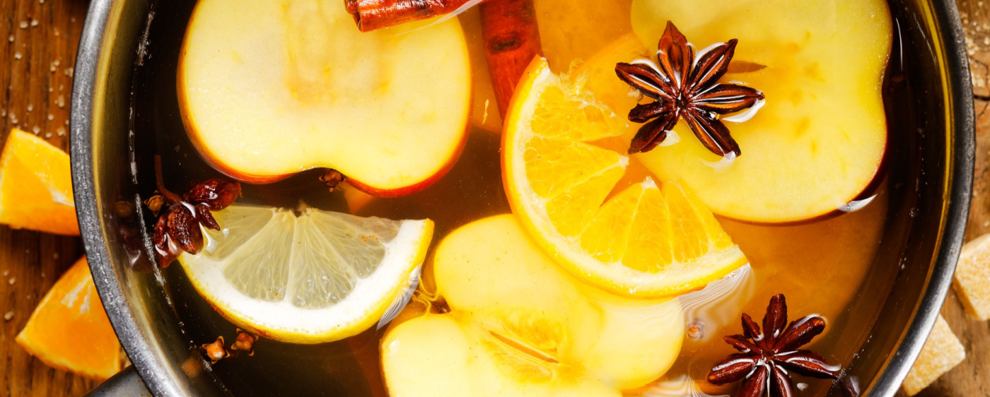 Citrus apple cider cooking on the stove.