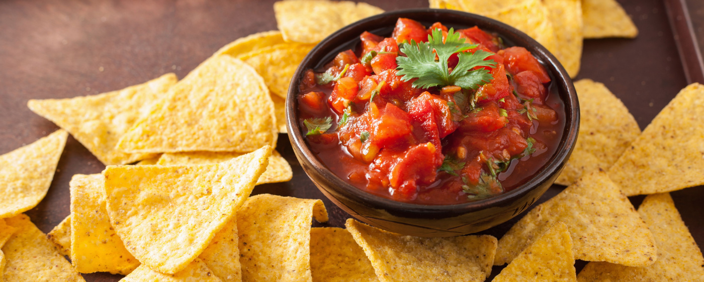 Homemade salsa paired with tortilla chips.