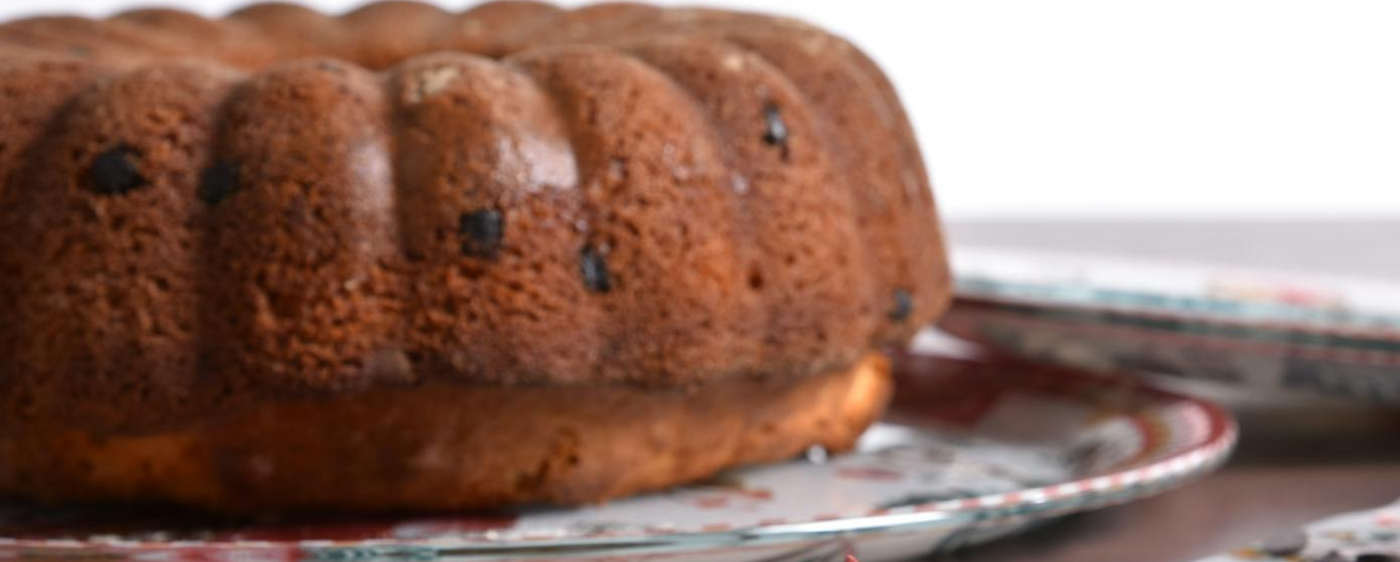 Prune cake cooling down on a dish.