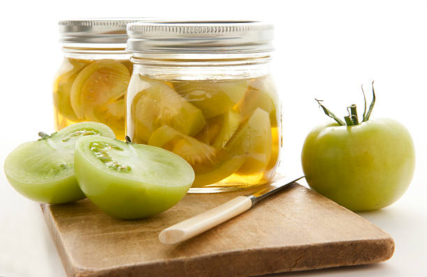 canning homemade green tomatoes - pickled green tomatoes stock pictures, royalty-free photos & images