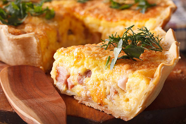 Cottage Quiche (bacon and cheese) slice with garnish.