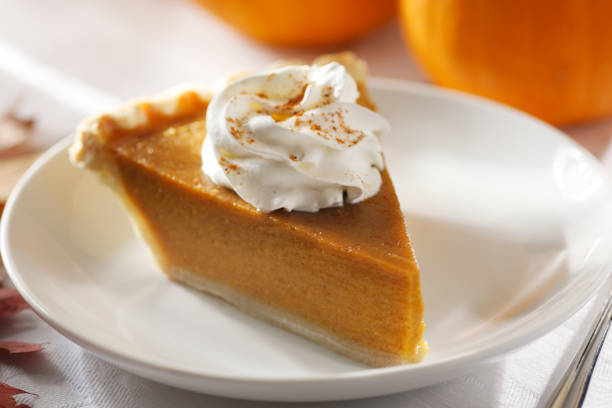 pumpkin pie with whipped cream - pumpkin pie stock pictures, royalty-free photos & images