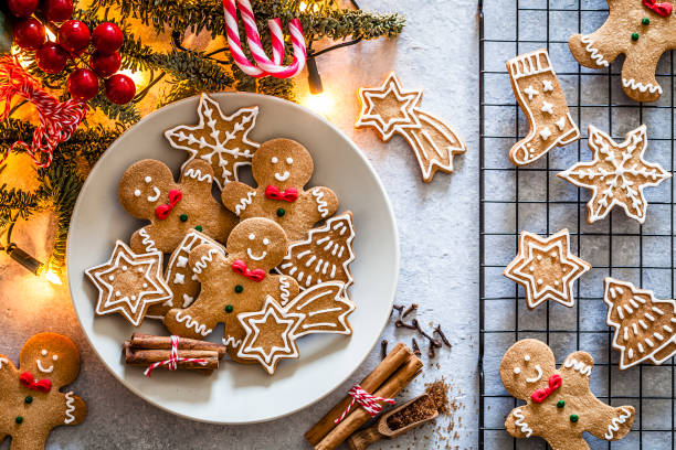 homemade christmas cookies on gray table - gingerbread man cookies stock pictures, royalty-free photos & images