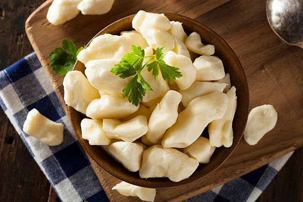 white dairy cheese curds - cheese curds stock pictures, royalty-free photos & images