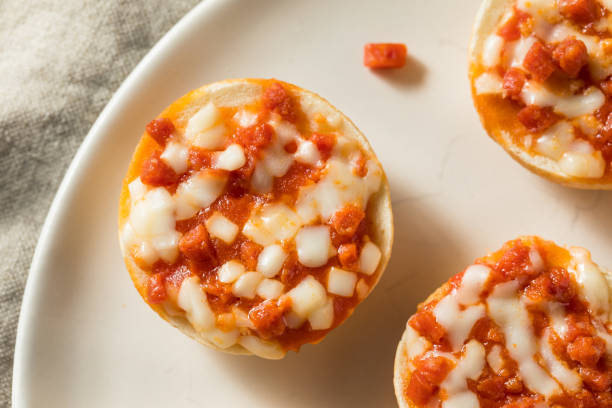 frozen mini pizza bagels - pizza bagel stock pictures, royalty-free photos & images