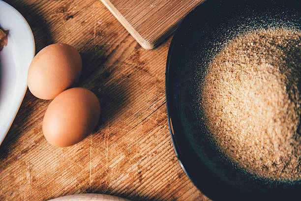 eggs and breadcrumbs - egg and bread crumbs stock pictures, royalty-free photos & images