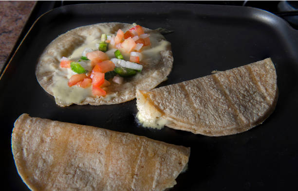 mexican snack, quesadillas - quesadilla making stock pictures, royalty-free photos & images