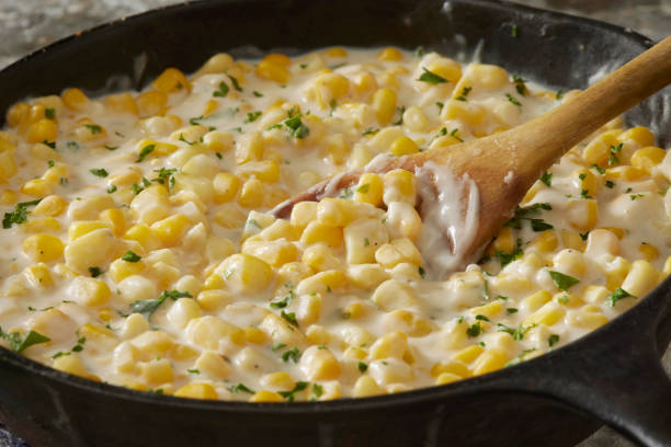 skillet creamed corn - butter corn side stock pictures, royalty-free photos & images