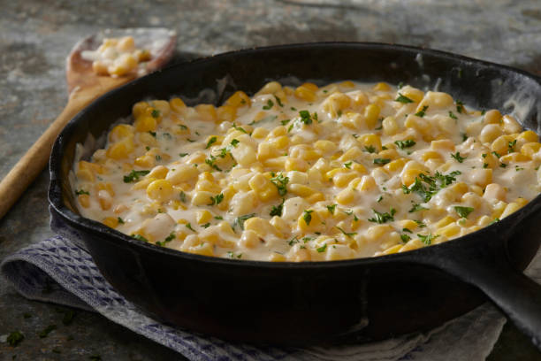 skillet creamed corn - butter corn side stock pictures, royalty-free photos & images