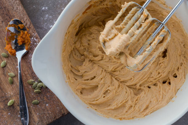 pumpkin batter in a bowl - pumpkin batter stock pictures, royalty-free photos & images