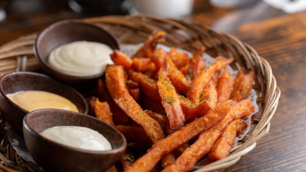 sweet potato french fries, condiments - sweet potato fries stock pictures, royalty-free photos & images