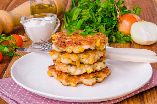 chicken fritters with corn, onions and fresh herbs - corn fritters stock pictures, royalty-free photos & images