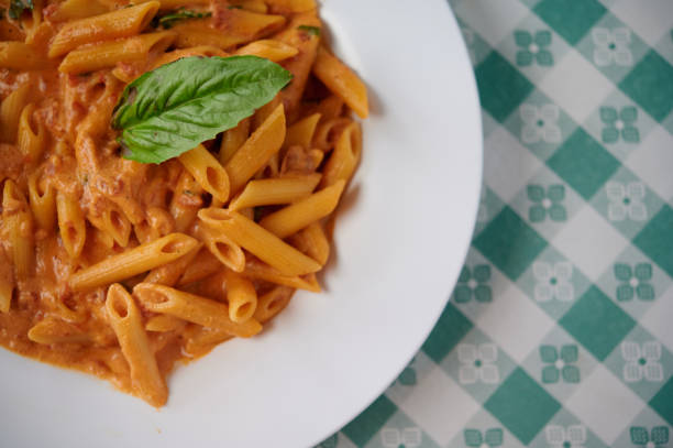 penne alla vodka , penne with vodka sauce - vodka sauce stock pictures, royalty-free photos & images