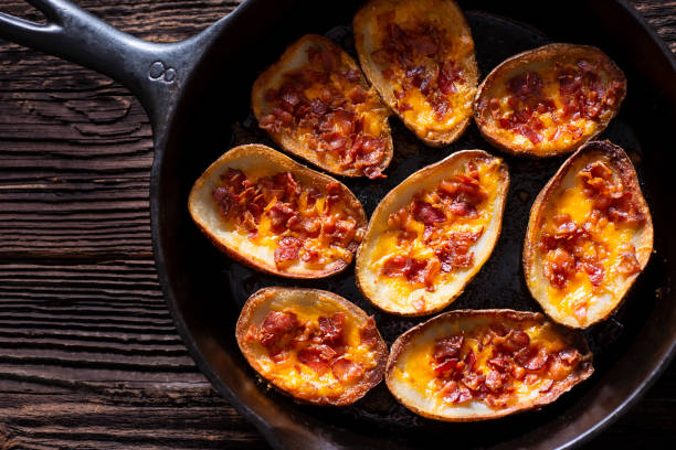 skillet potato skins - bacon and cheese potato stock pictures, royalty-free photos & images