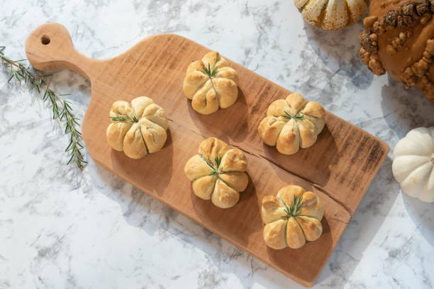 pumpkin shaped biscuits. - pumpkin shaped bread stock pictures, royalty-free photos & images