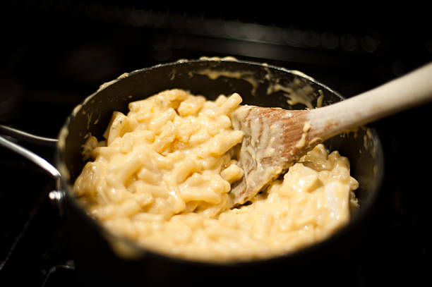 stovetop mac 'n' cheese - mac n cheese stock pictures, royalty-free photos & images