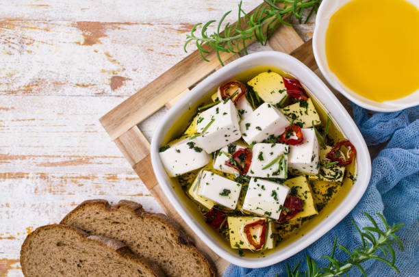 traditional white cheese slices - marinated feta stock pictures, royalty-free photos & images