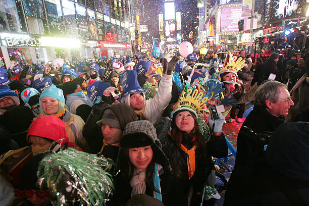 Revelers celebrate New Year in Times Square moments after the ball dropped January 01, 2009 in New York City. The Times Square Alliance estimates...