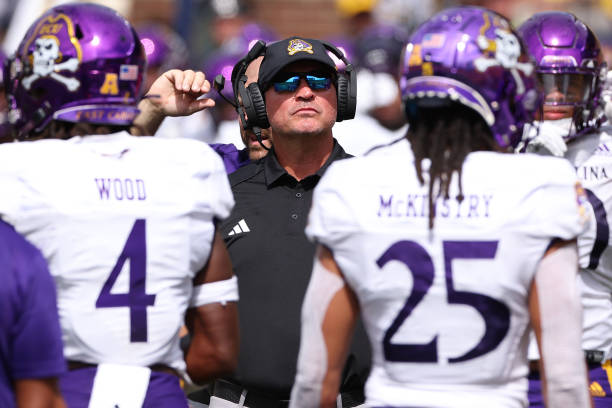 Head coach Mike Houston of the East Carolina Pirates looks on in the second half while playing the Michigan Wolverines at Michigan Stadium on...