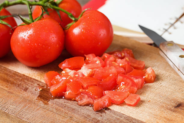 chopped tomatoes - diced tomato stock pictures, royalty-free photos & images