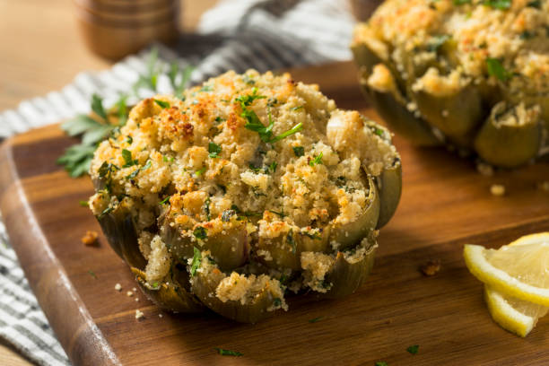 homemade stuffed baked artichokes - stuffed artichokes stock pictures, royalty-free photos & images