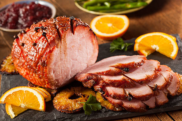 traditional sliced honey glazed ham - honey baked ham stock pictures, royalty-free photos & images