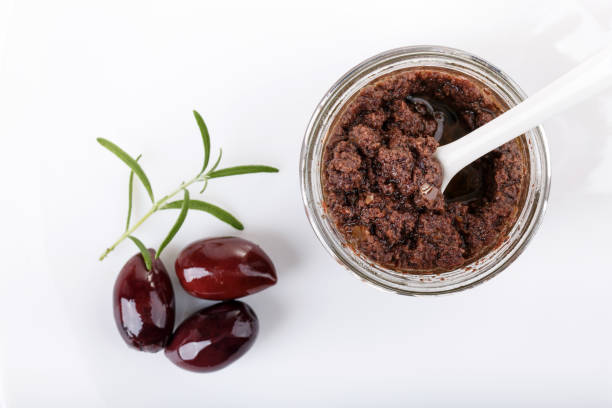 tapenade, olive paste made from kalamata olives. top view. - olive tapenade stock pictures, royalty-free photos & images