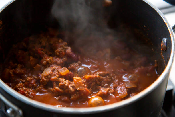 chilli con carne - making chili stock pictures, royalty-free photos & images