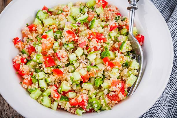 homemade tabbouleh salad with quinoa and vegetables - quinoa salad stock pictures, royalty-free photos & images