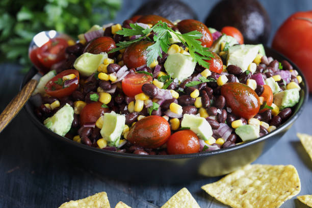 delicious mexican black bean and corn salad or texas caviar bean dip - corn and black bean salsa stock pictures, royalty-free photos & images