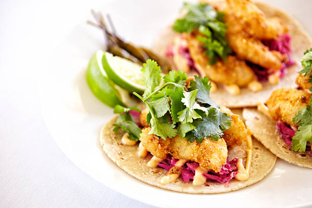 close up of fish tacos on a plate - fish tacos stock pictures, royalty-free photos & images