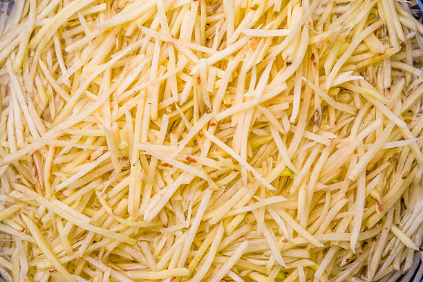 shredded potatoes - shredded potato stock pictures, royalty-free photos & images