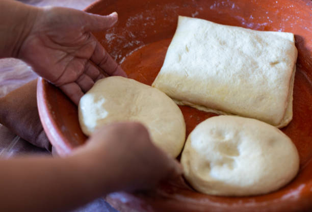 woman making rghayef (moroccan crepes) - making concha bread stock pictures, royalty-free photos & images