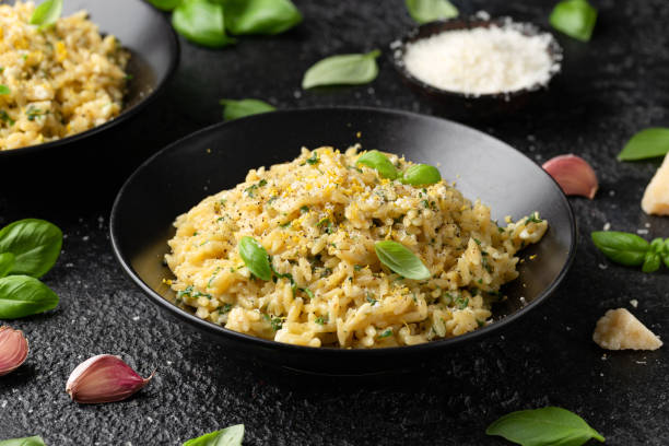 creamy garlic and parmesan orzo pasta with lemon zest and parsley - orzo with parmesan & basil stock pictures, royalty-free photos & images